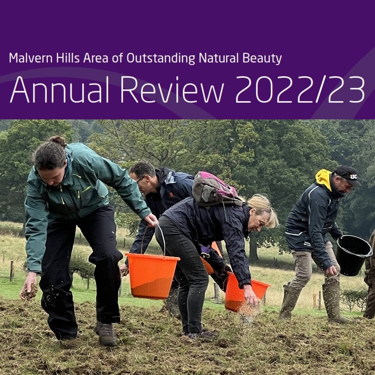Cover of Annual Review showing sowing wildflower seed